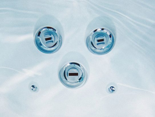 Underwater image of Sundance Spas deep-tissue jet seat.