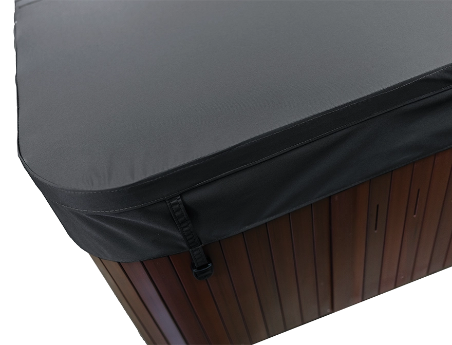 Black hot tub cover on a brown hot tub.